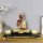 Meditating Buddha Statue on Wooden Tray
